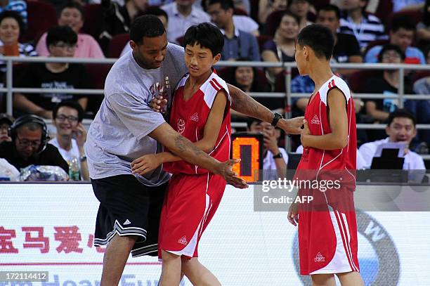 This picture taken on July 1, 2013 shows NBA star Tracy McGrady at the 2013 Yao Foundation Charity Game in Beijing. The game between China team and...