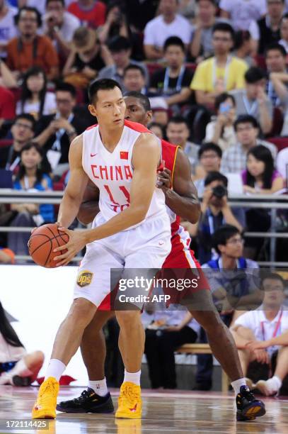 This picture taken on July 1, 2013 shows Chinese basketball player Yi Jianlian attending the 2013 Yao Foundation Charity Game in Beijing. The game...