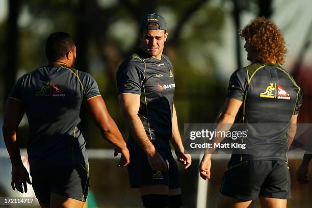 Wallabies captain James Horwill warms up with team mates during an Australian Wallabies training session at St Joseph's, Hunter's Hill on July 2,...