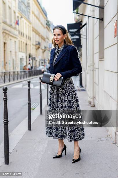 Influencer Alexandra Lapp, wearing a Maison Common short boucle jacket with ribbon details in navy, a Maison Common long sleeve blouse with plastron...