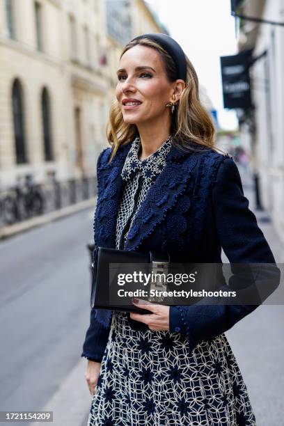 Influencer Alexandra Lapp, wearing a Maison Common short boucle jacket with ribbon details in navy, a Maison Common long sleeve blouse with plastron...
