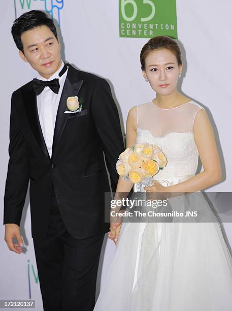 Do Kyung-Wan and Jang Yoon-Jung pose for photographs before their wedding at 63 building convention center on June 28, 2013 in Seoul, South Korea.