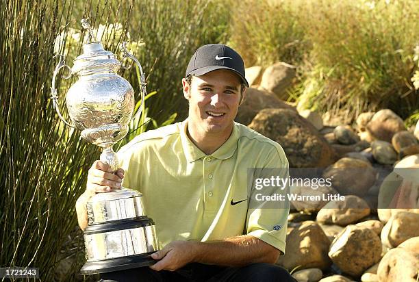 Trevor Immelman of South Africa poses with the trophy after winning the South African Airways Open at the Erinvale Golf Club in Cape Town, South...