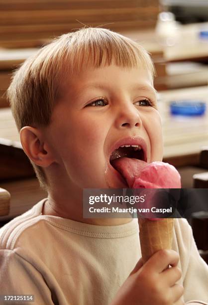 boy eating icecream - child eyes closed stock pictures, royalty-free photos & images