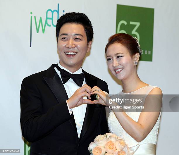 Do Kyung-Wan and Jang Yoon-Jung pose for photographs before their Wedding at 63 building convention center on June 28, 2013 in Seoul, South Korea.