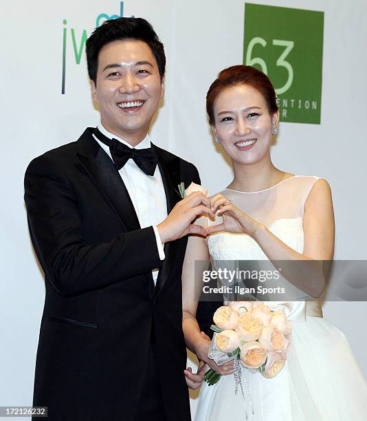 Do Kyung-Wan and Jang Yoon-Jung pose for photographs before their Wedding at 63 building convention center on June 28, 2013 in Seoul, South Korea.