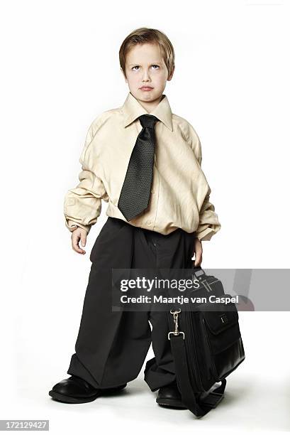 child in baggy business suit and briefcase - boy clothes stock pictures, royalty-free photos & images