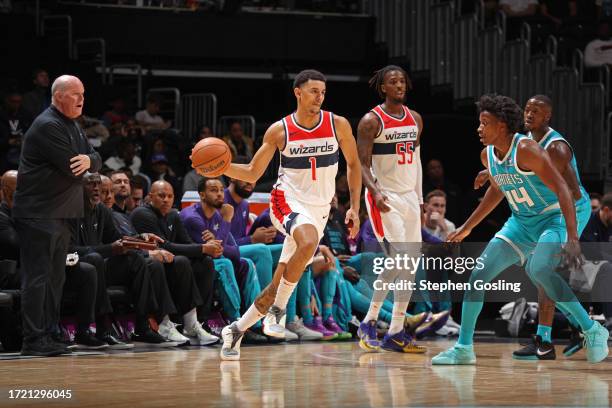 Johnny Davis of the Washington Wizards passes the ball during the game against the Charlotte Hornets on October 12, 2023 at Capital One Arena in...