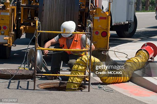 utility worker - manhole stock pictures, royalty-free photos & images