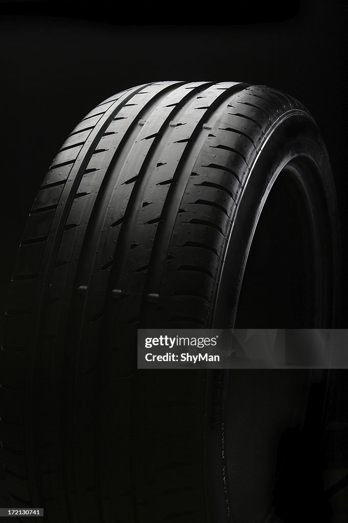 A tire with new black background