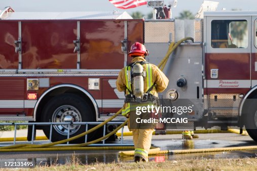 A picture of a firefighter on a job A picture of a firefighter on a job