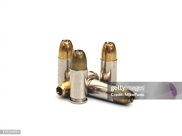 several bullets isolated on a white background - munition stockfoto's en -beelden