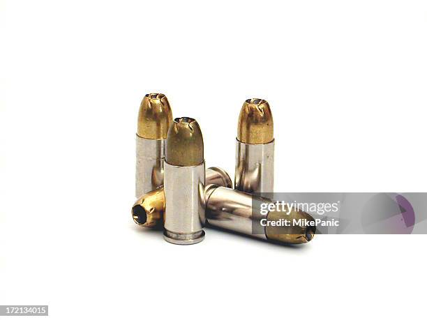 several bullets isolated on a white background - ammunition stock pictures, royalty-free photos & images