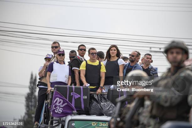 Daniel Noboa, presidential candidate for Accion Nacional Democratica coalition, center, greets his supporters during a campaign rally in Guayaquil,...