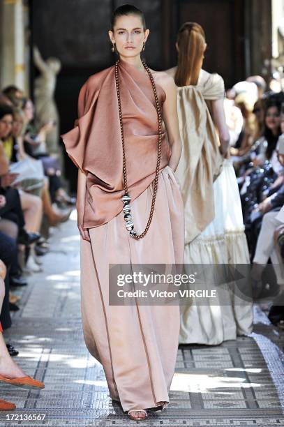 Model walks the runway during the Christophe Josse show as part of Paris Fashion Week Haute-Couture Fall/Winter 2013-2014 at les Beaux Arts on July...