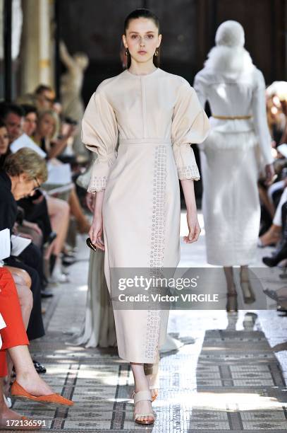 Model walks the runway during the Christophe Josse show as part of Paris Fashion Week Haute-Couture Fall/Winter 2013-2014 at les Beaux Arts on July...