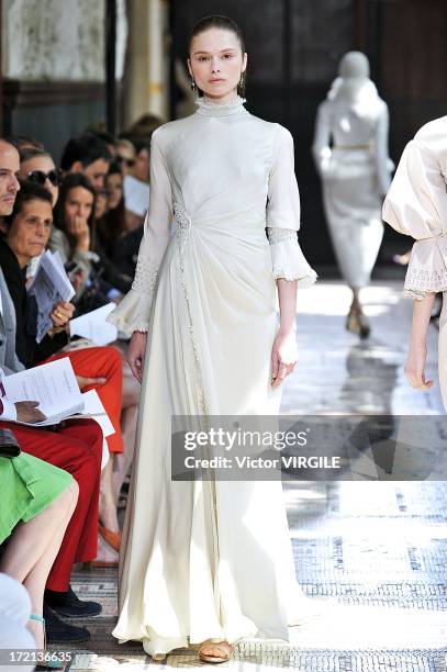 Model walks the runway during the Christophe Josse show as part of Paris Fashion Week Haute-Couture Fall/Winter 2013-2014 at les Beaux Arts on July...