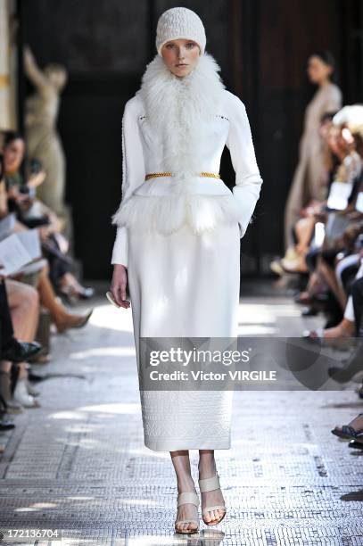 Model walks the runway during the Christophe Josse show as part of Paris Fashion Week Haute-Couture Fall/Winter 2013-2014 at les Beaux Arts on July...