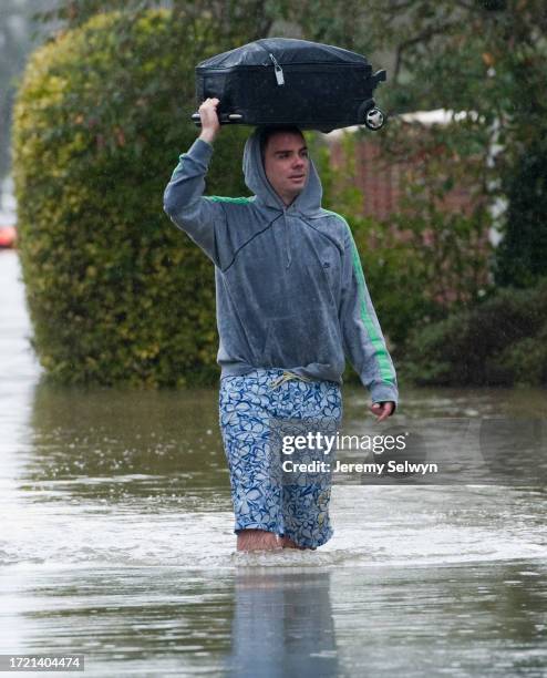 Resident Struggling To Move In The Flood Water In Wraysbury, Berkshire, England. .Maximum Preparations Were Under Way To Help Protect The Capital...