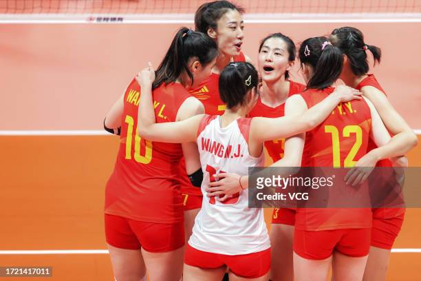 Players of Team China celebrate duing the Volleyball - Semifinal match against Team Thailand on day 13 of the 19th Asian Games at Hangzhou Normal...