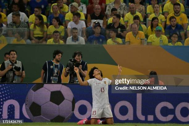 Venezuela's midfielder Eduard Bello celebrates after scoring during the 2026 FIFA World Cup South American qualification football match between...