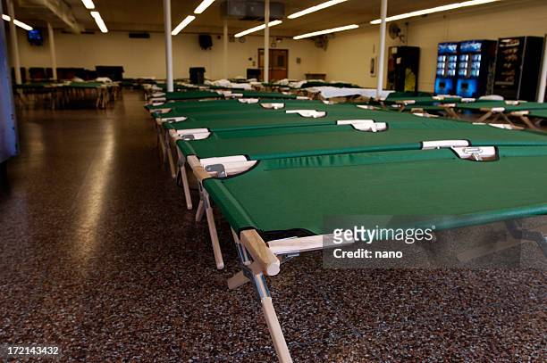 flood-nj shelter cots - disaster relief stock pictures, royalty-free photos & images