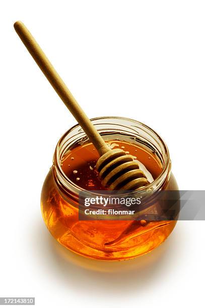 miel con varillas de vidrio - honey fotografías e imágenes de stock