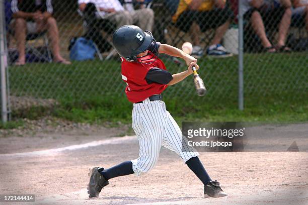 baseball player hitting foul ball - ungdomsliga för baseboll och softboll bildbanksfoton och bilder
