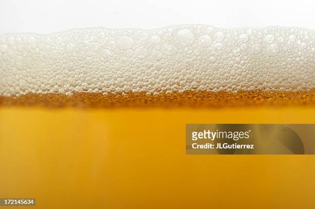 close up of beer bubbles in glass - beer splashing stock pictures, royalty-free photos & images