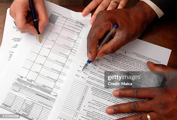 taxes and paperwork - 1040 stockfoto's en -beelden