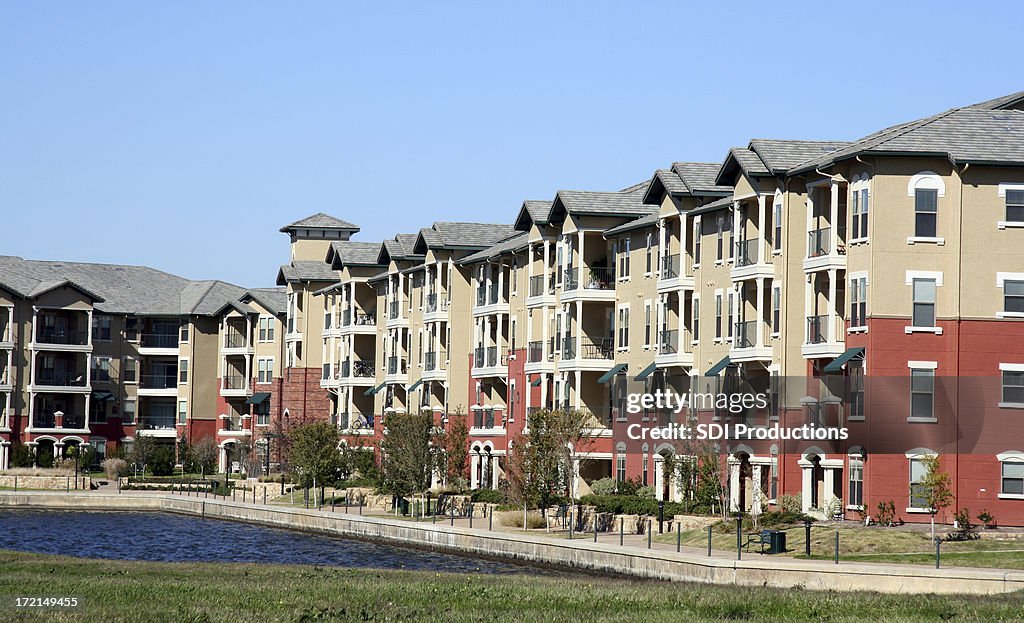 Luxurious Apartment Complex Overlooking A Pond