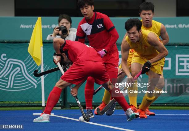 Chen Chengfu of Team China competes in the Hockey - Men's Classification against Team South Korea on day 13 of the 19th Asian Games at Gongshu Canal...