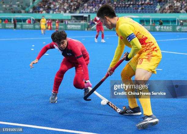 Lin Changliang of Team China competes in the Hockey - Men's Classification against Team South Korea on day 13 of the 19th Asian Games at Gongshu...