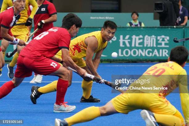 Wenhui of Team China competes in the Hockey - Men's Classification against Team South Korea on day 13 of the 19th Asian Games at Gongshu Canal Sports...
