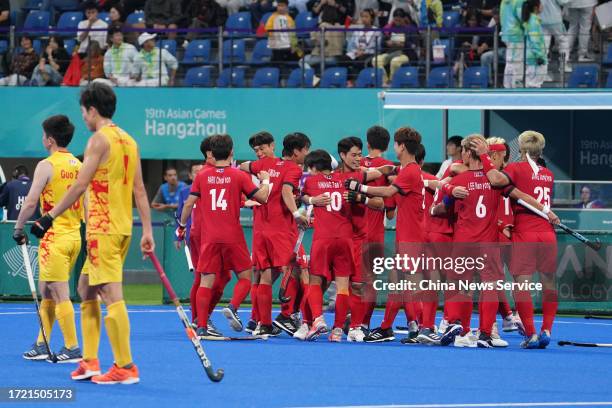 Players of Team China celebrate after winning the Hockey - Men's Classification against Team China on day 13 of the 19th Asian Games at Gongshu Canal...