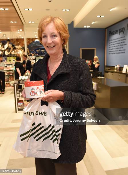 John Lewis St Pancras Opening Today..1St Customer Helen Frost With Her Christmas Mug For ¿9.99. 14-October-2014
