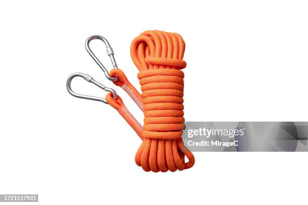 a bundle of climbing ropes isolated on white - equipamento de alpinismo imagens e fotografias de stock