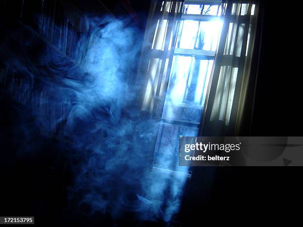 creepy shot of a smoky room at night - haunted house stock pictures, royalty-free photos & images