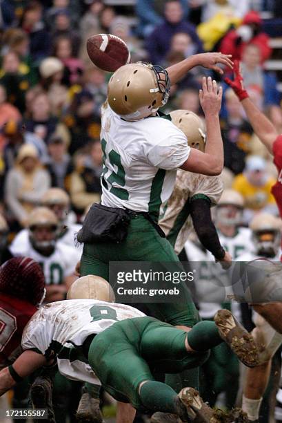 american football - blocked pass - quarterback throwing stock pictures, royalty-free photos & images
