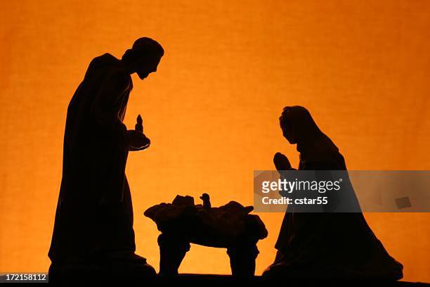 religious: christmas nativity trio silhouette on gold - new life stockfoto's en -beelden