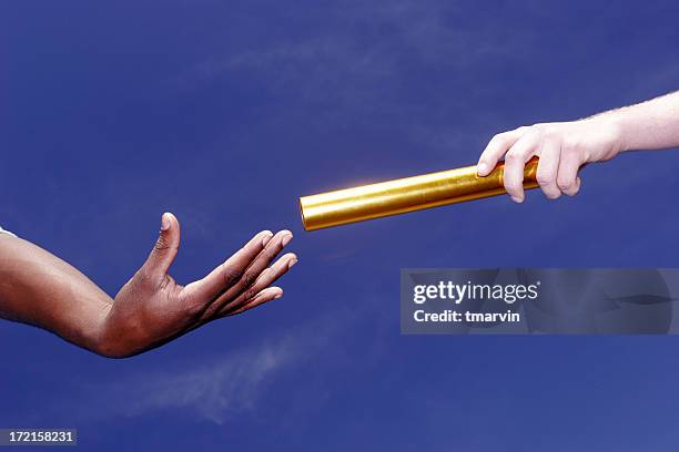 passing the baton - track and field baton stock pictures, royalty-free photos & images