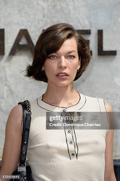 Milla Jovovich attends the Chanel show as part of Paris Fashion Week Haute Couture Fall/Winter 2013-2014 at Grand Palais on July 2, 2013 in Paris,...