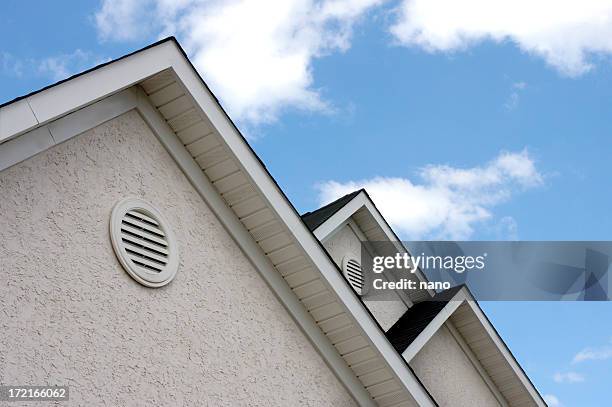 close up of roof peaks against blue sky - luftintag bildbanksfoton och bilder