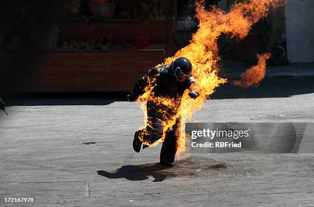 man on fire - dare devil stock pictures, royalty-free photos & images