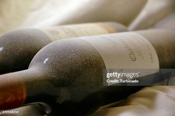 dusty wine bottles 1 - wine cellar stock pictures, royalty-free photos & images