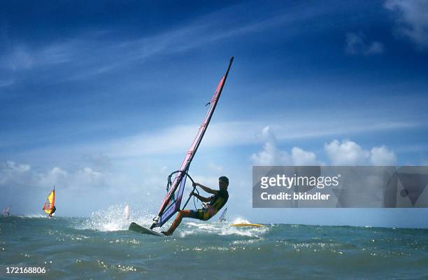 surfers - windsurf stock pictures, royalty-free photos & images