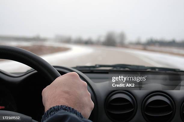 winter driving - hand steering wheel stock pictures, royalty-free photos & images