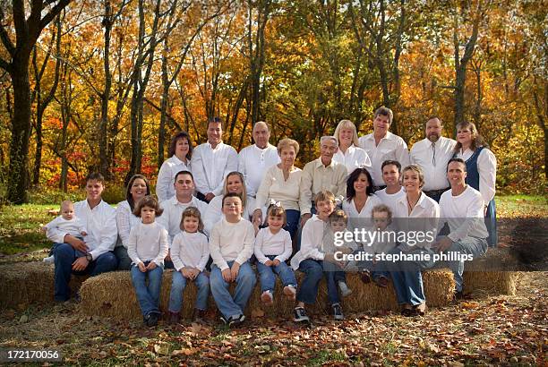 large family group wearing white shirts for portrait - family reunion stock pictures, royalty-free photos & images
