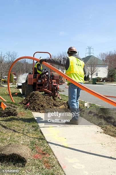 fishing the cable - cable installation stock pictures, royalty-free photos & images