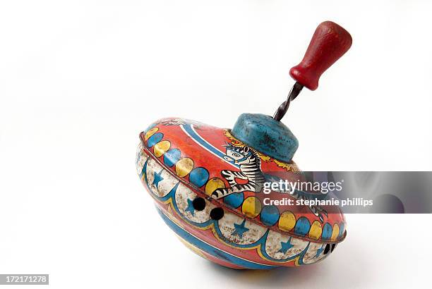 antique brightly painted metal child's toy spinning top - toy bildbanksfoton och bilder